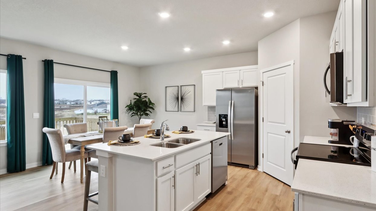 Kitchen with white cabinetry and quartz countertop
