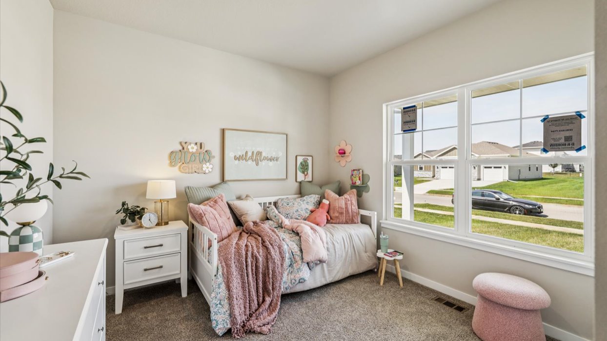 Comfortable secondary bedroom with natural light, modern finishes, and versatile living space.