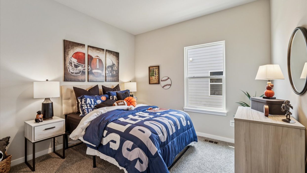 Comfortable secondary bedroom with natural light, modern finishes, and versatile living space.