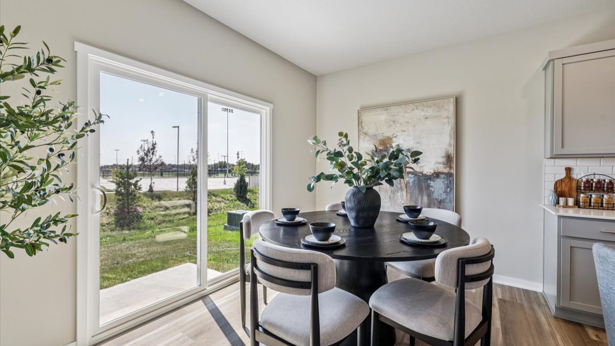 Open concept dining space with access to backyard