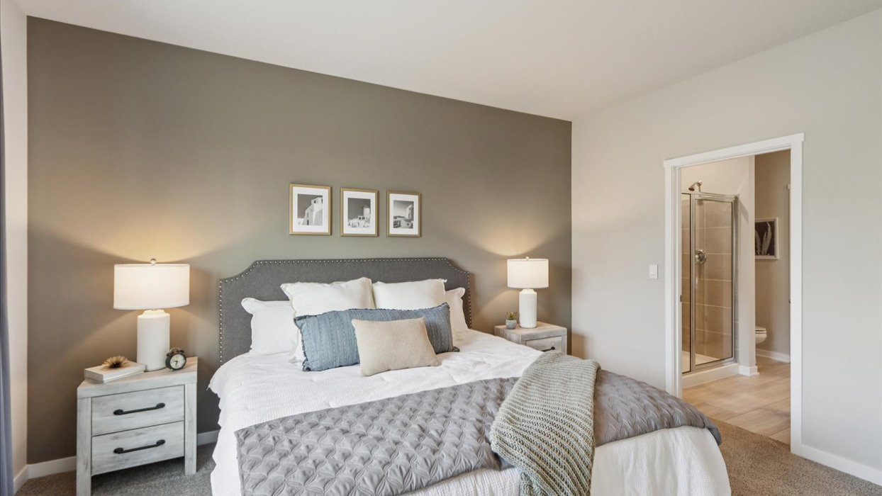 Primary bedroom with natural lighting and spacious layout
