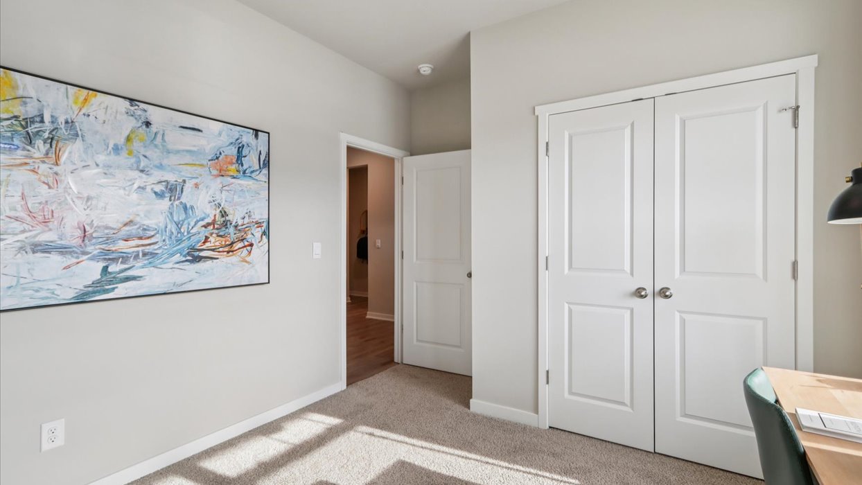 Comfortable secondary bedroom with natural light, modern finishes, and versatile living space.