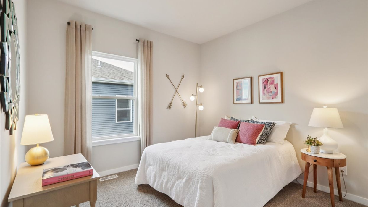 Comfortable secondary bedroom with natural light, modern finishes, and versatile living space.