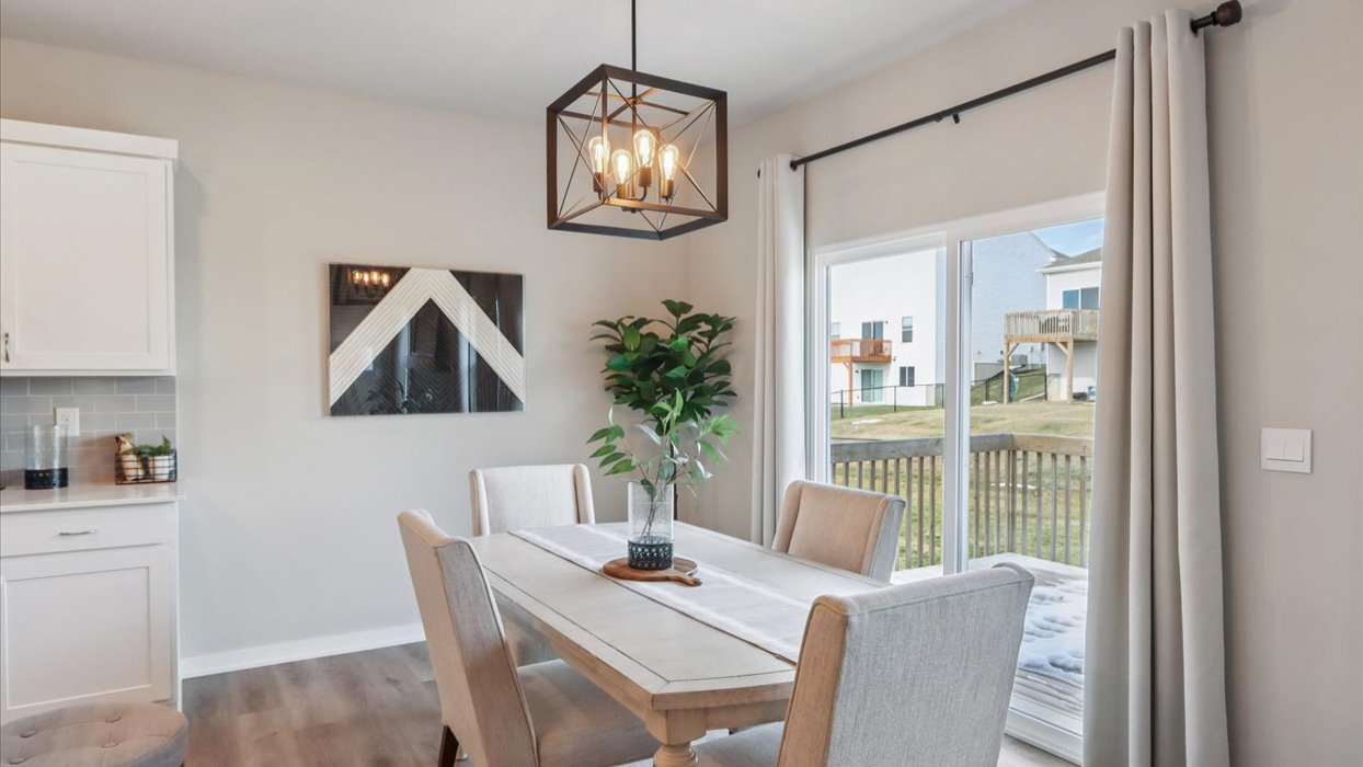 Open concept dining space with access to backyard
