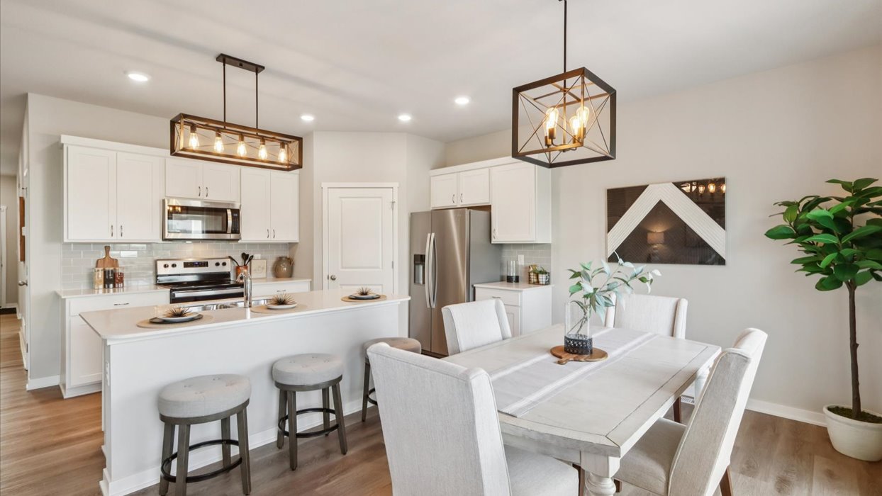 Open concept dining space with access to backyard