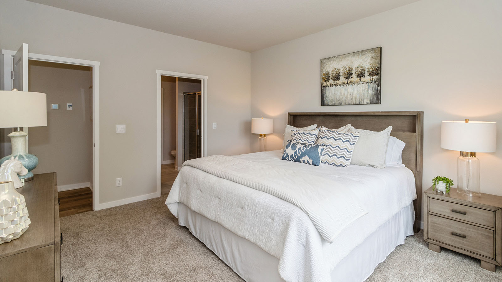 hamilton primary bedroom with view of walk-in closet