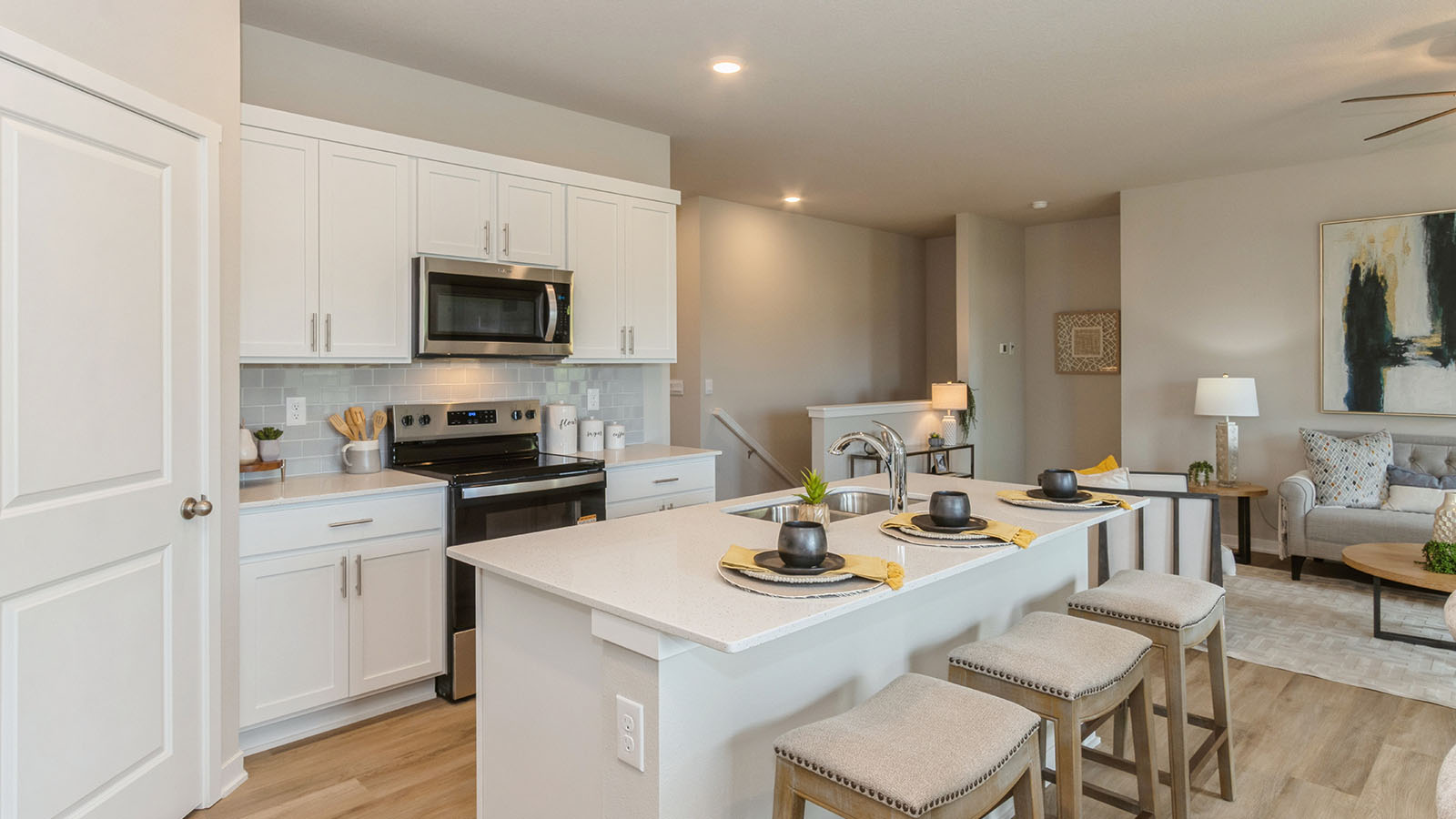 hamilton kitchen with quartz island and brown barstools