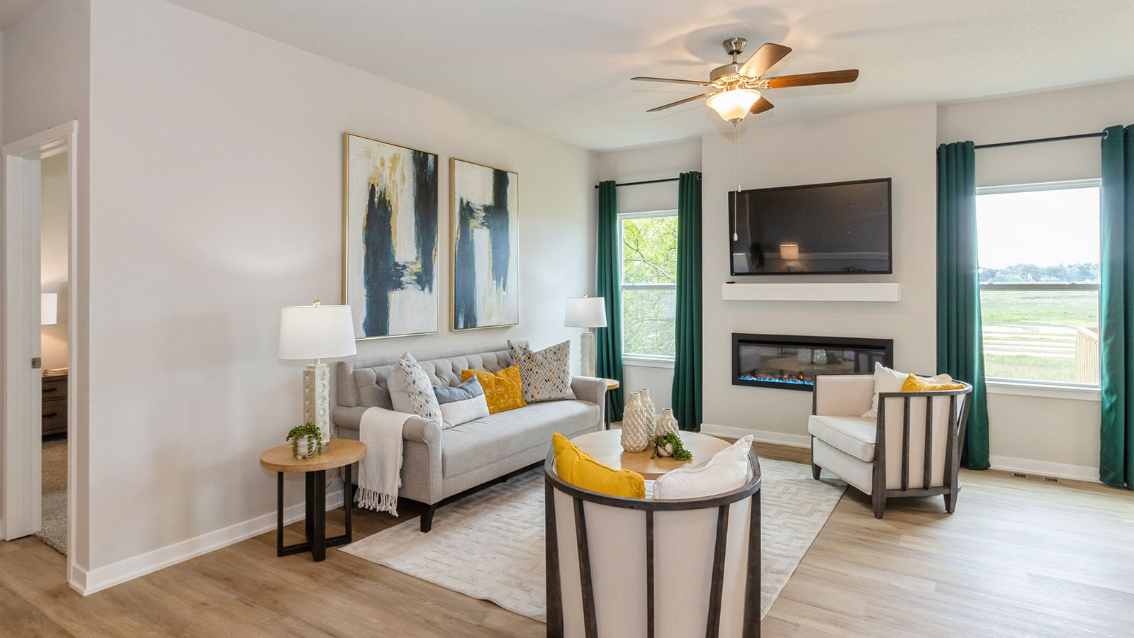 cozy living room with two small windows and electric fireplace