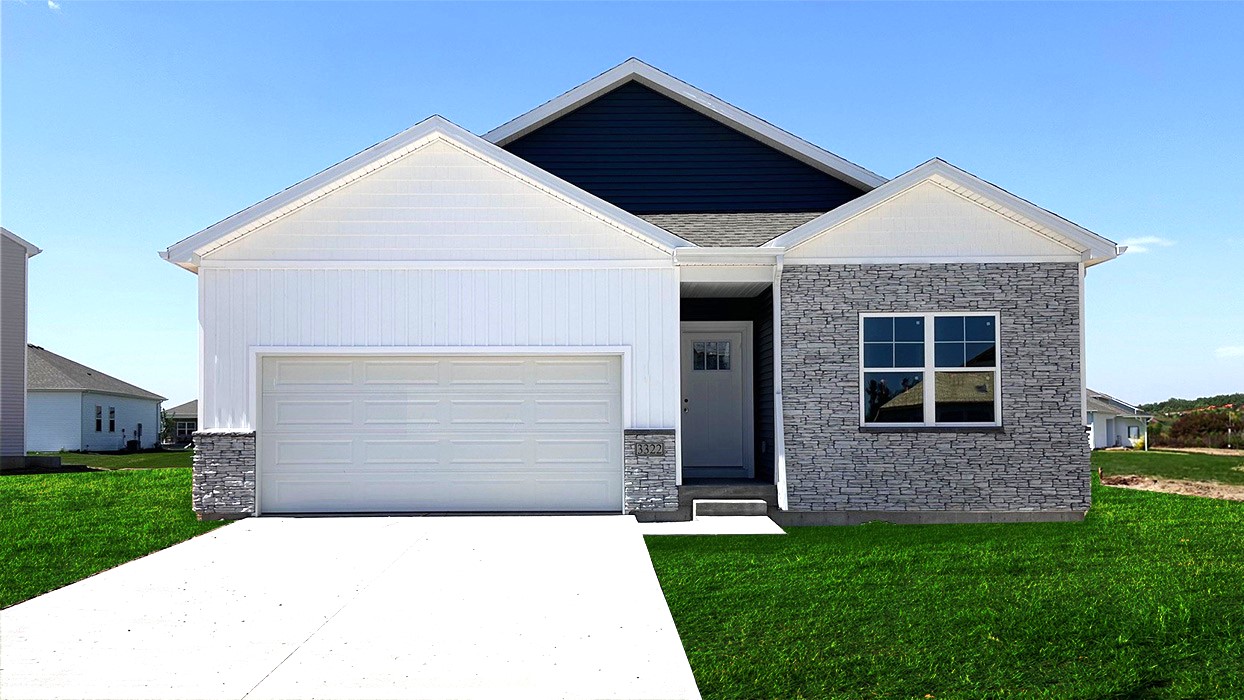 Exterior photo of the Aldridge a one-story plan with blue and white siding and a two-car garage