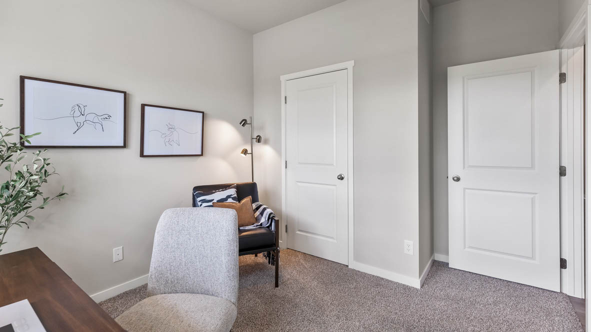 Comfortable secondary bedroom with natural light, modern finishes, and versatile living space.