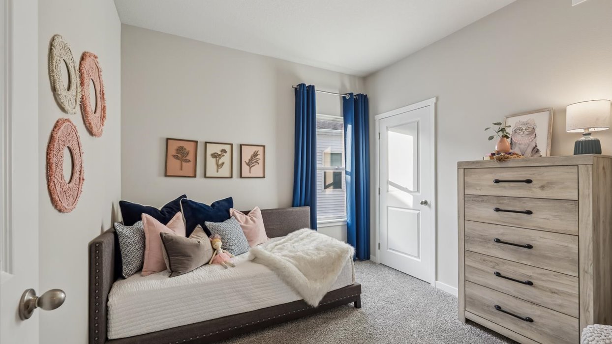 Comfortable secondary bedroom with natural light, modern finishes, and versatile living space.