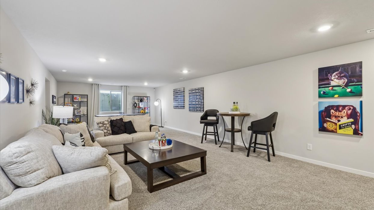 Finished basement living area with comfortable seating space and flexible room for entertaining or relaxing.