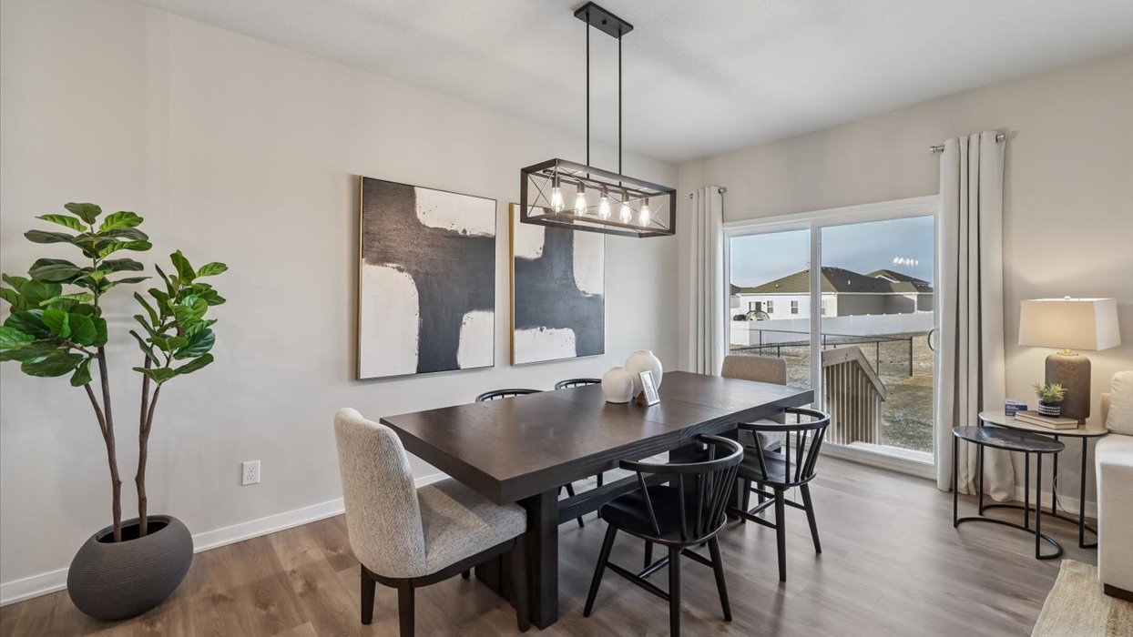 Open concept dining space with access to backyard