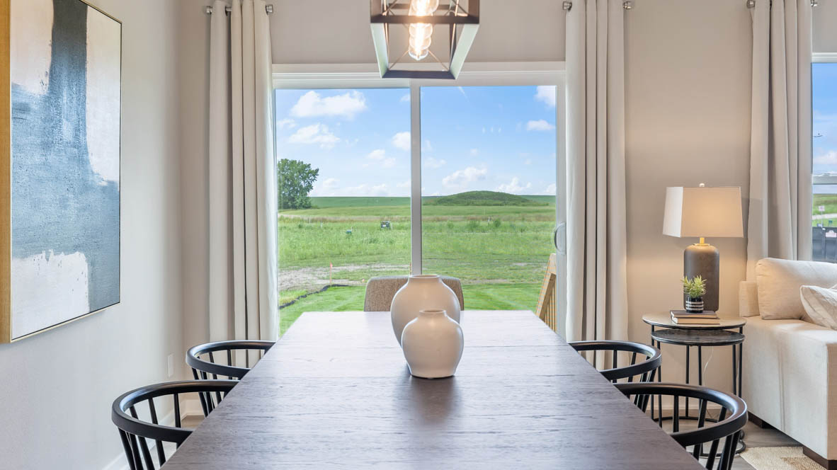 Open concept dining space with access to backyard