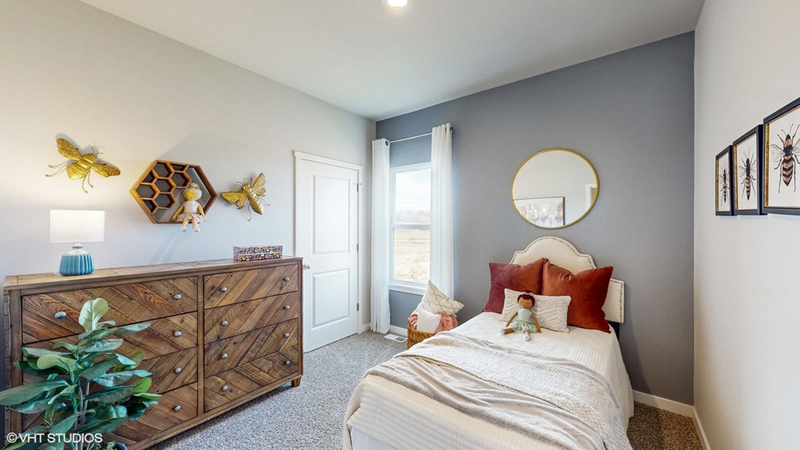 fourth bedroom of the Rolan with a twin bed and wooden dresser