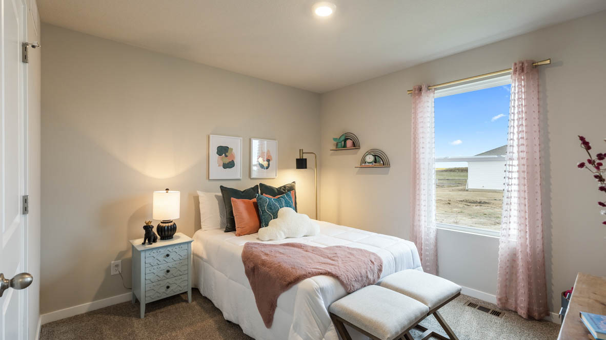 Comfortable secondary bedroom with natural light, modern finishes, and versatile living space.