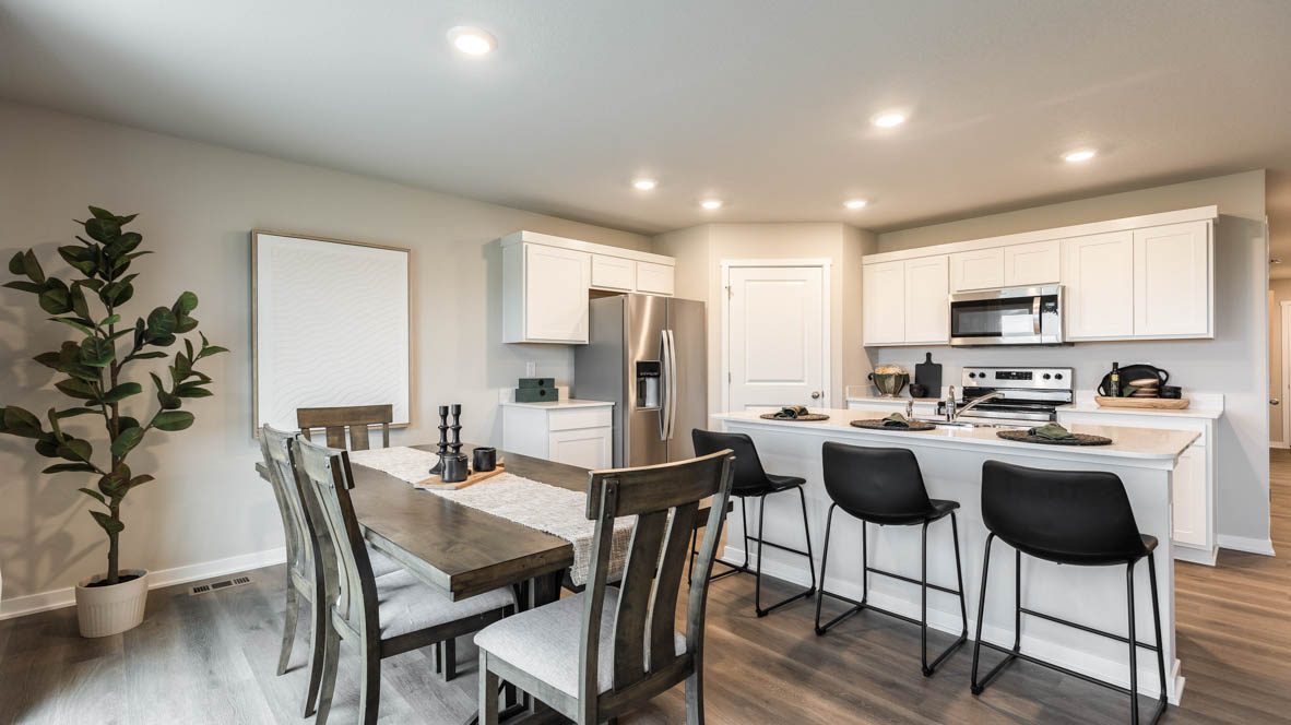 Open concept dining space with access to backyard