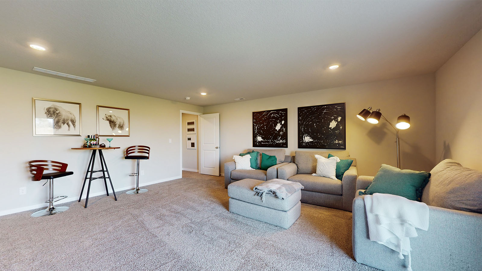 finished basement with two grey couches