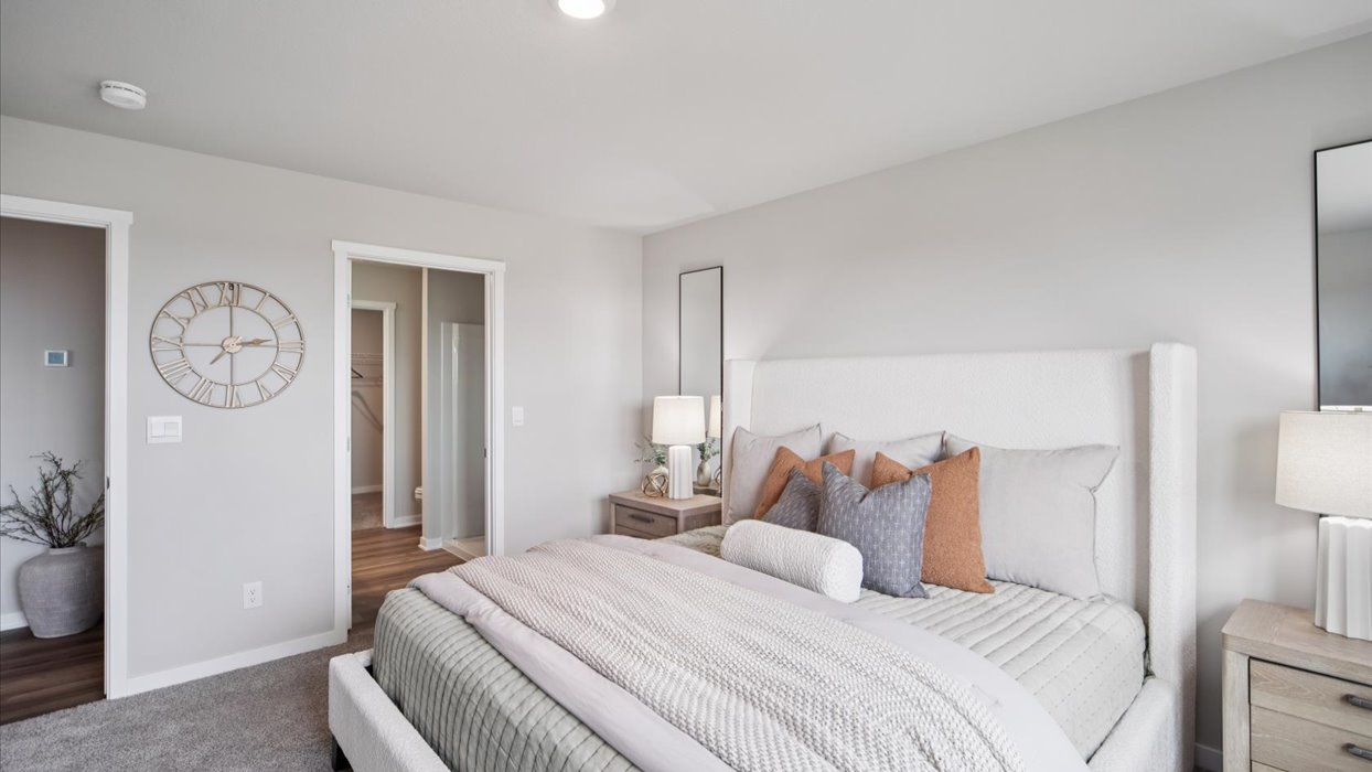 Primary bedroom with natural lighting and spacious layout