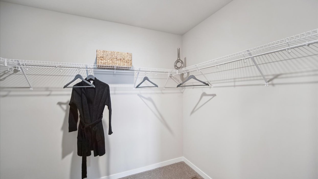 Spacious walk-in closet offering ample room for clothing, accessories, and everyday essentials.