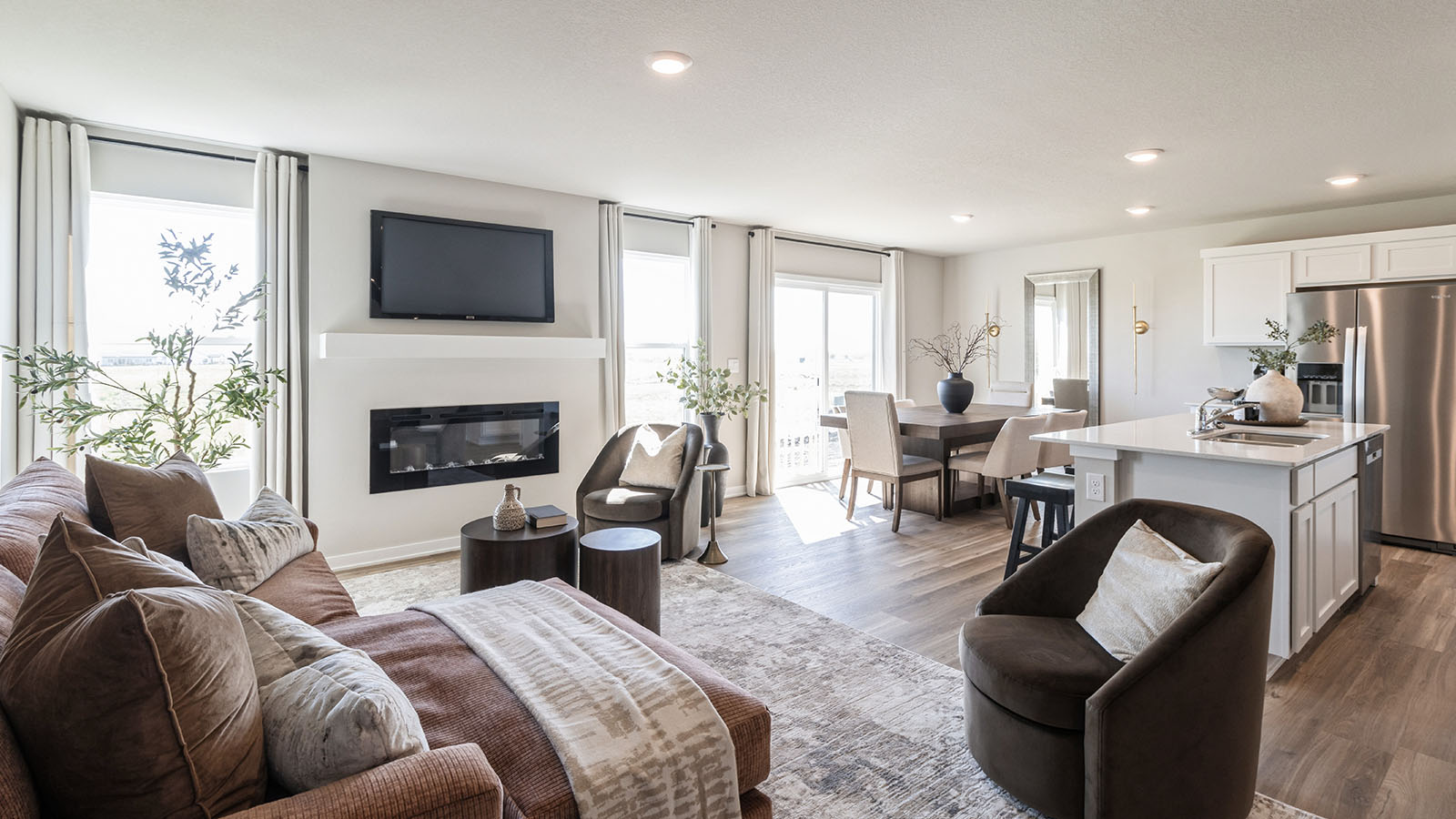 Open concept living room with electric fireplace