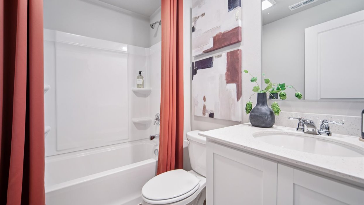 Stylish lower-level bathroom featuring contemporary fixtures and convenient access from the finished basement.