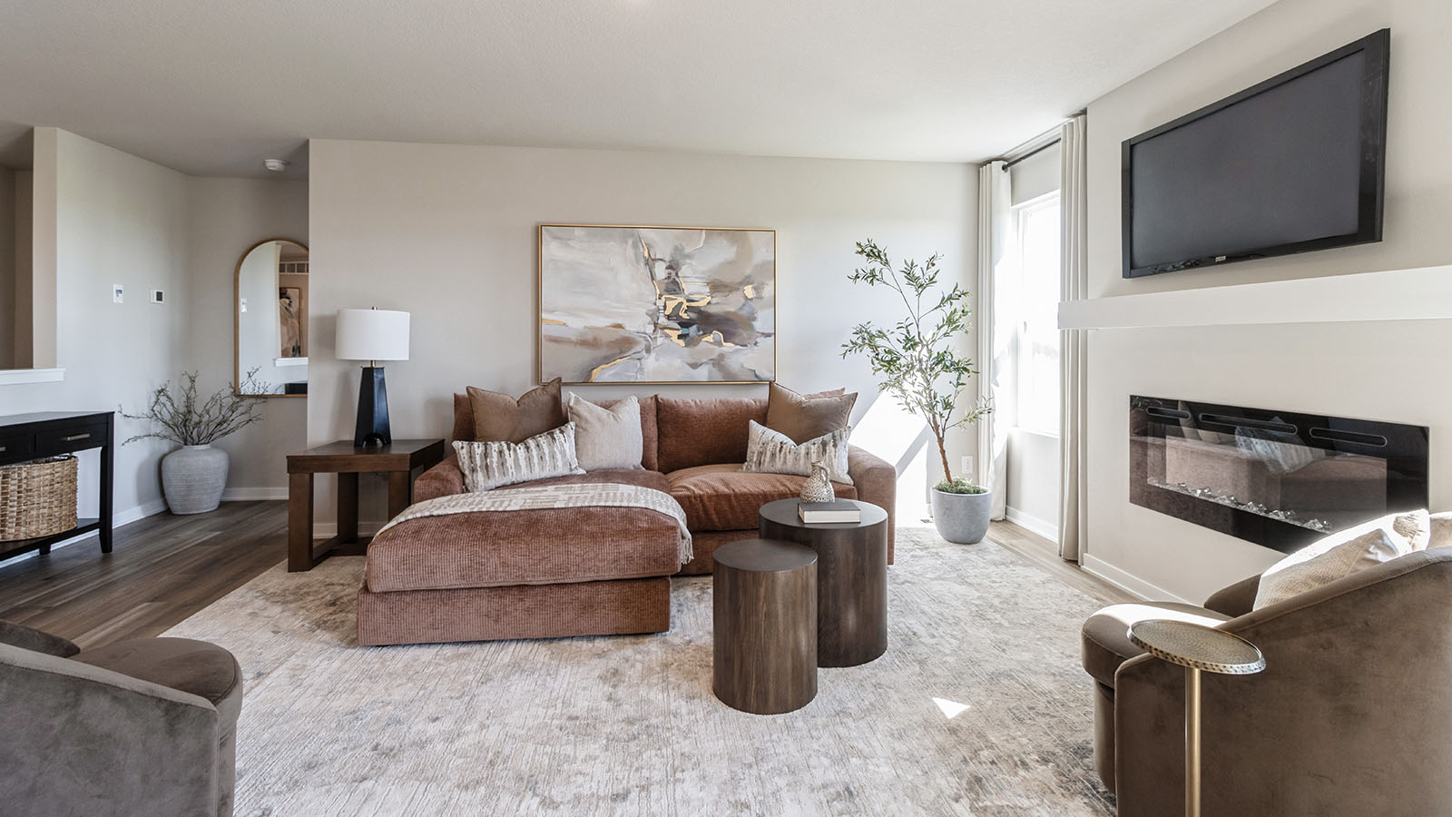 Open concept living room with electric fireplace