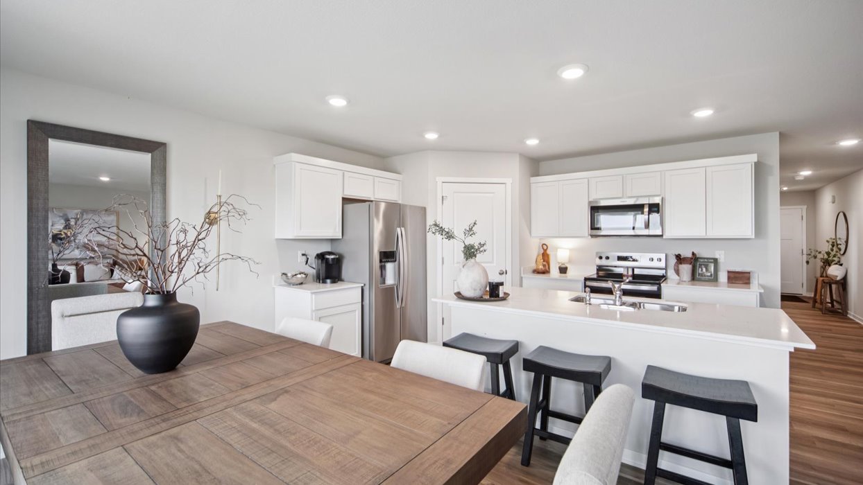 Kitchen with white cabinetry and quartz countertop