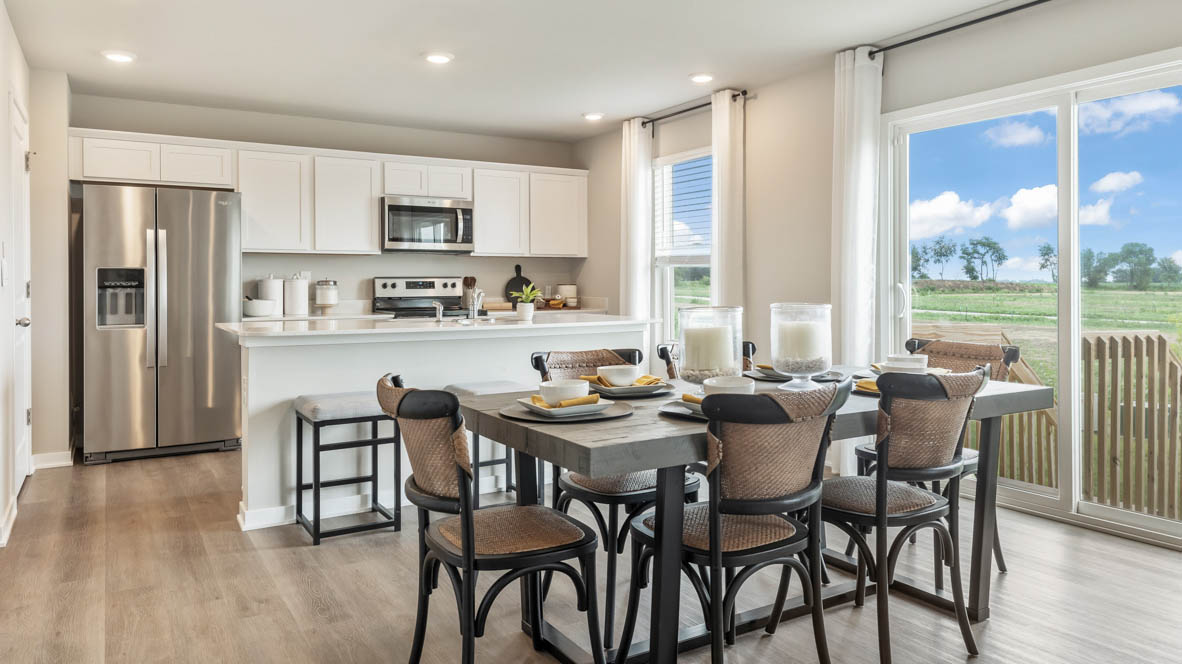 Bellhaven kitchen with white cabinets and a kitchen island with 2 chairs