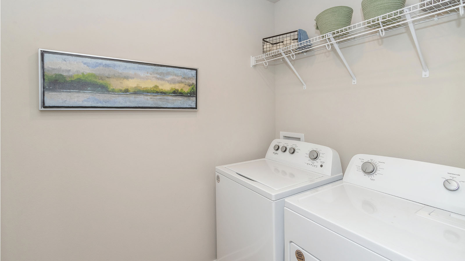 laundry room with shelving and washer and dryer