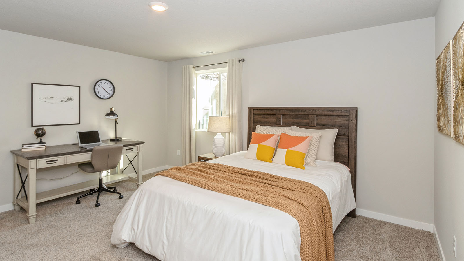 third bedroom with white bed and desk with small egress window