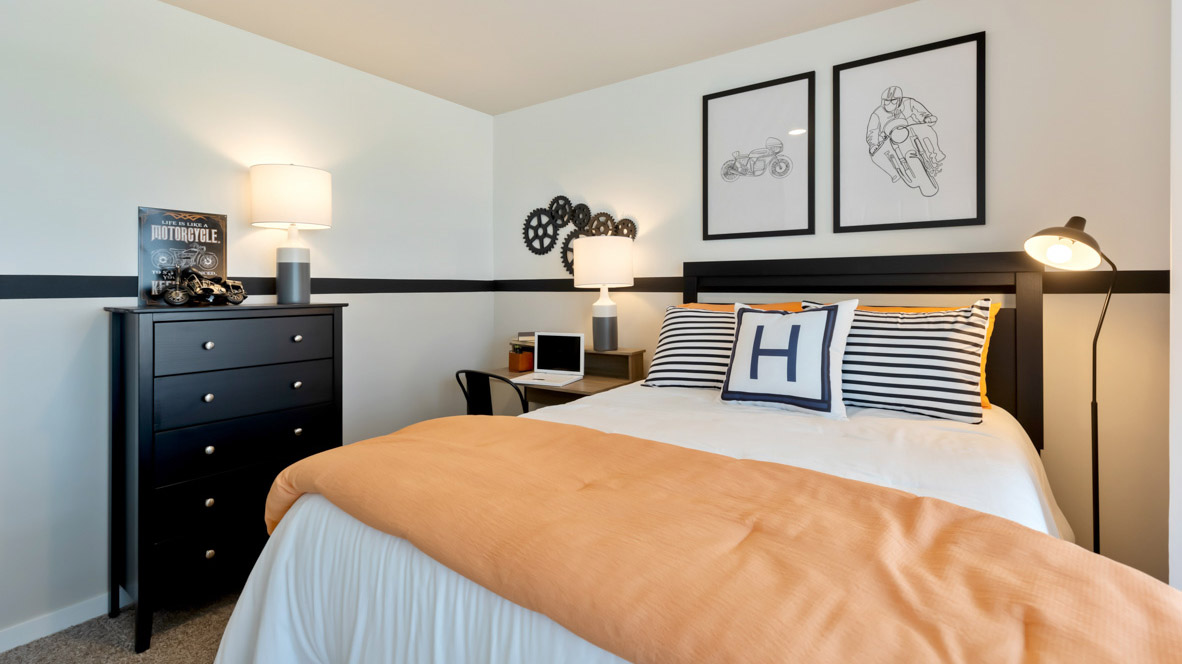 Comfortable secondary bedroom with natural light, modern finishes, and versatile living space.