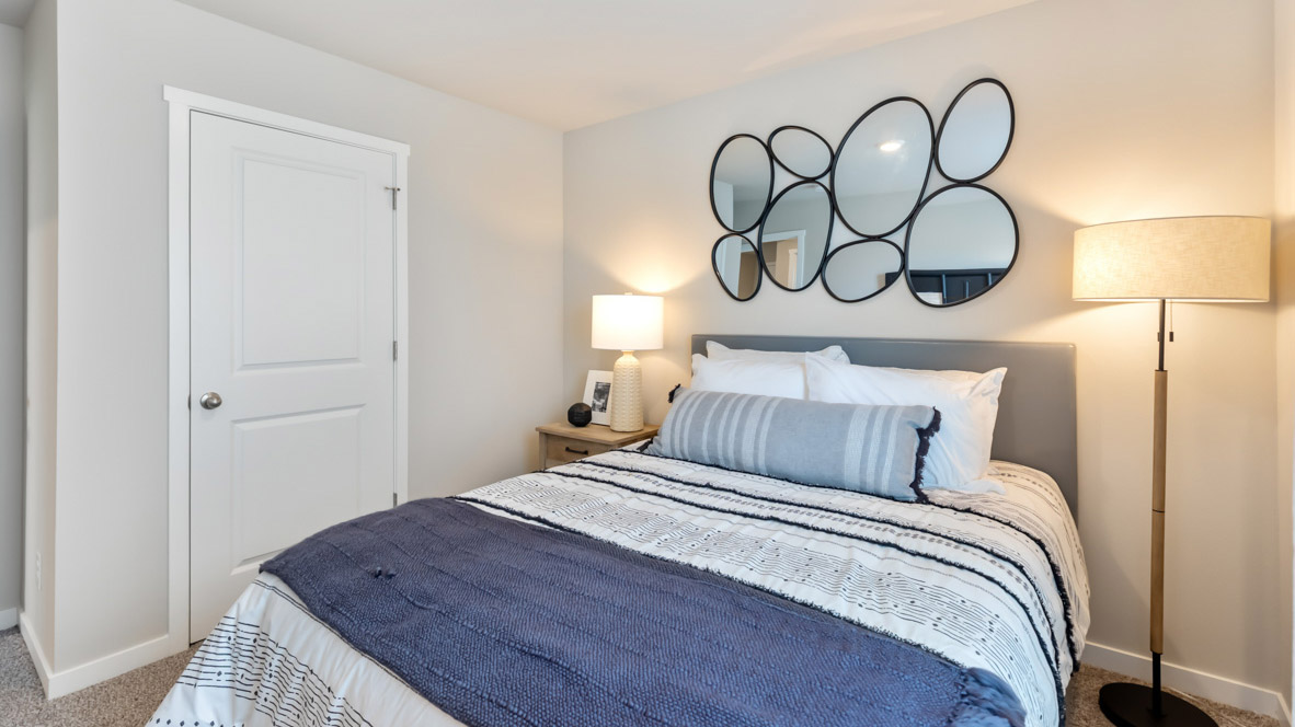 Comfortable secondary bedroom with natural light, modern finishes, and versatile living space.