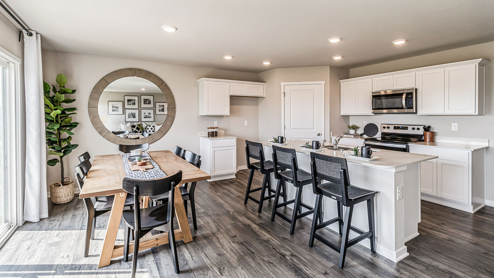 Open concept dining space with access to backyard