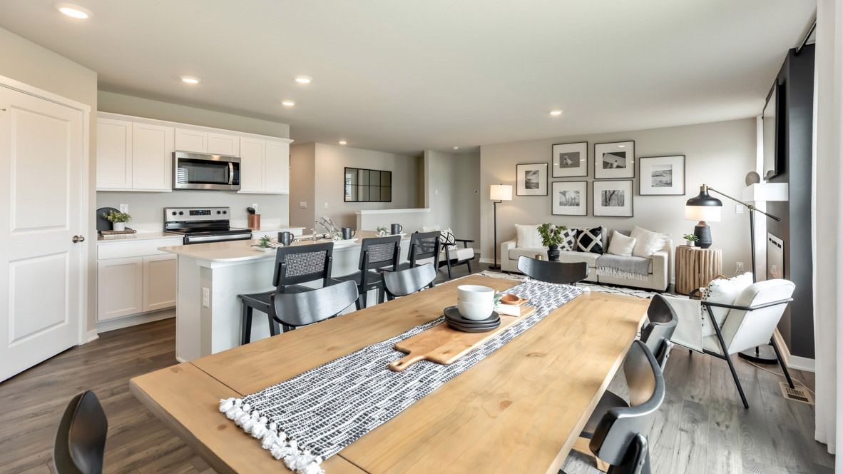 Open concept dining space with access to backyard