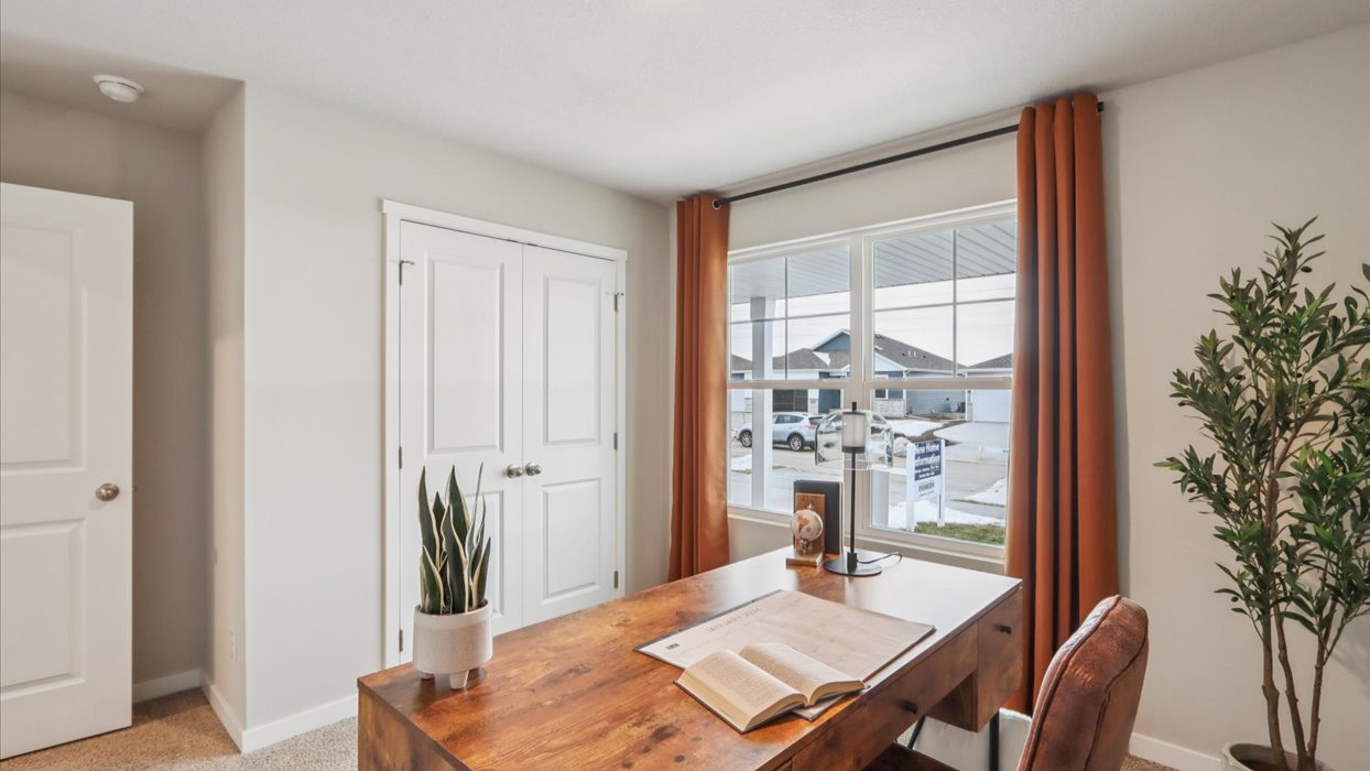 Comfortable secondary bedroom with natural light, modern finishes, and versatile living space.
