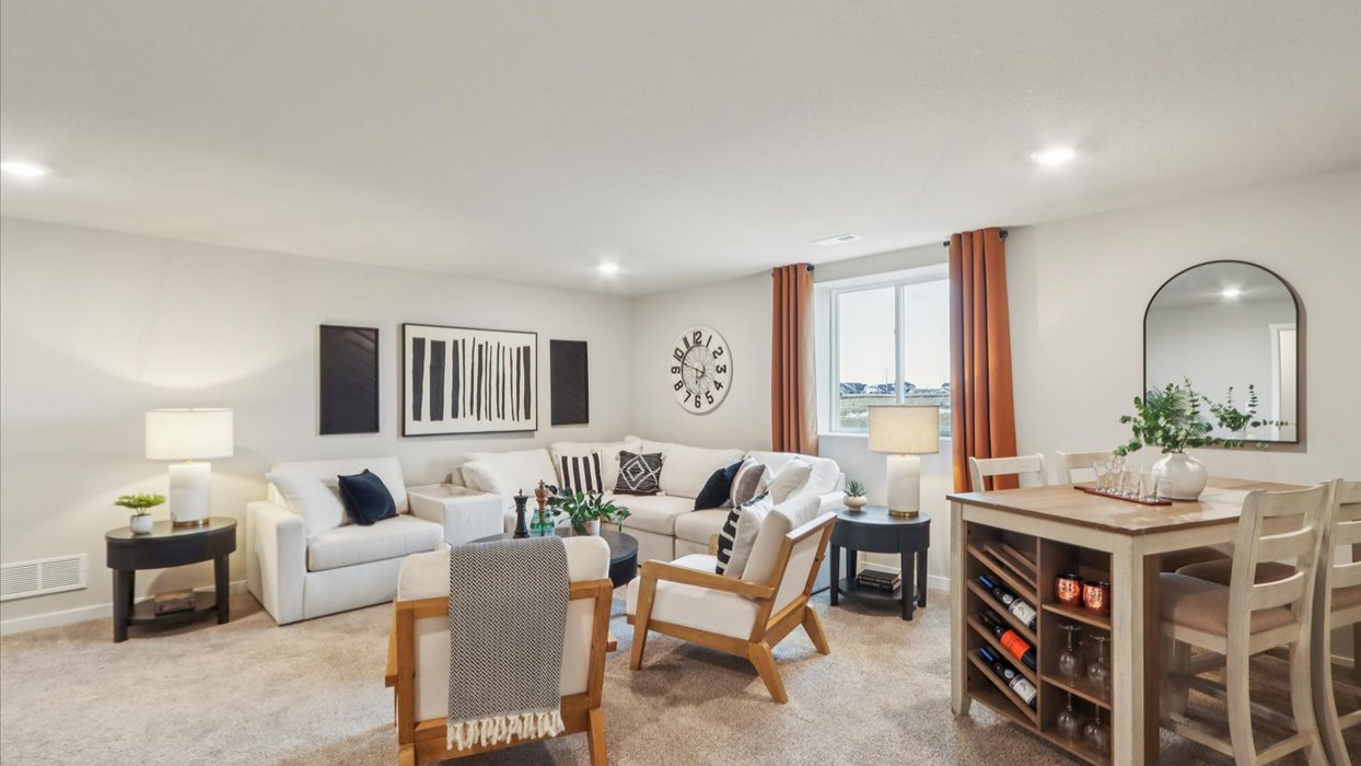 Finished basement living area with comfortable seating space and flexible room for entertaining or relaxing.