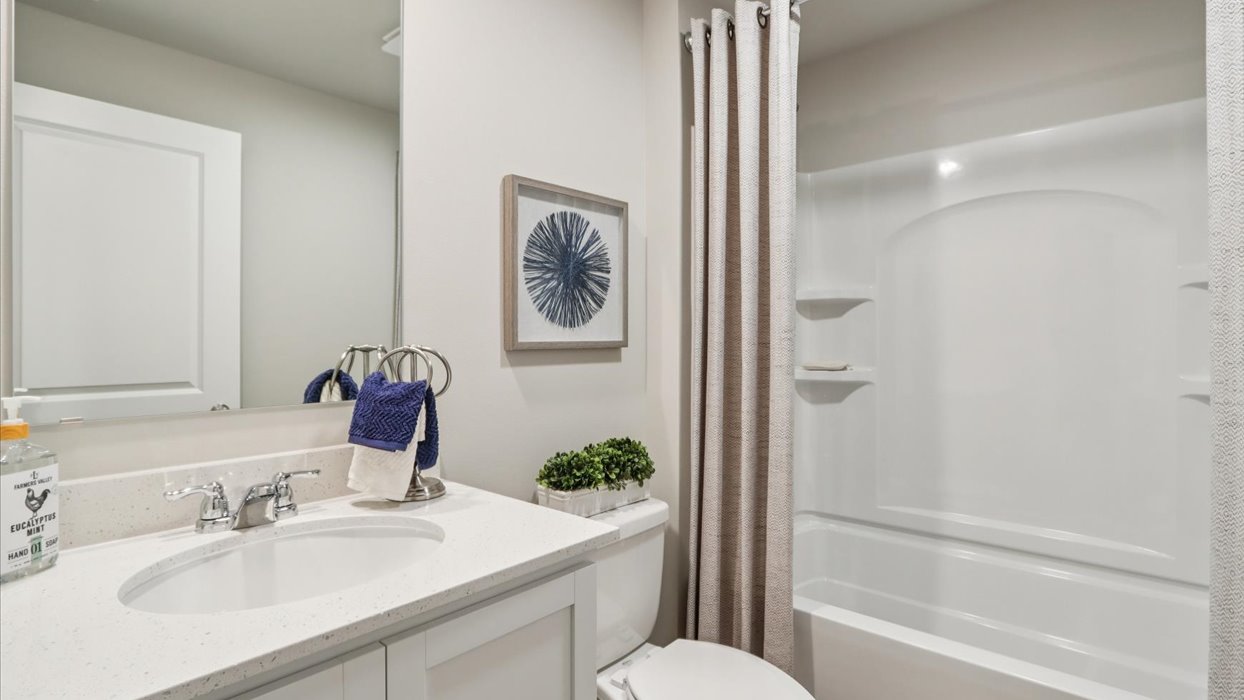 Stylish lower-level bathroom featuring contemporary fixtures and convenient access from the finished basement.