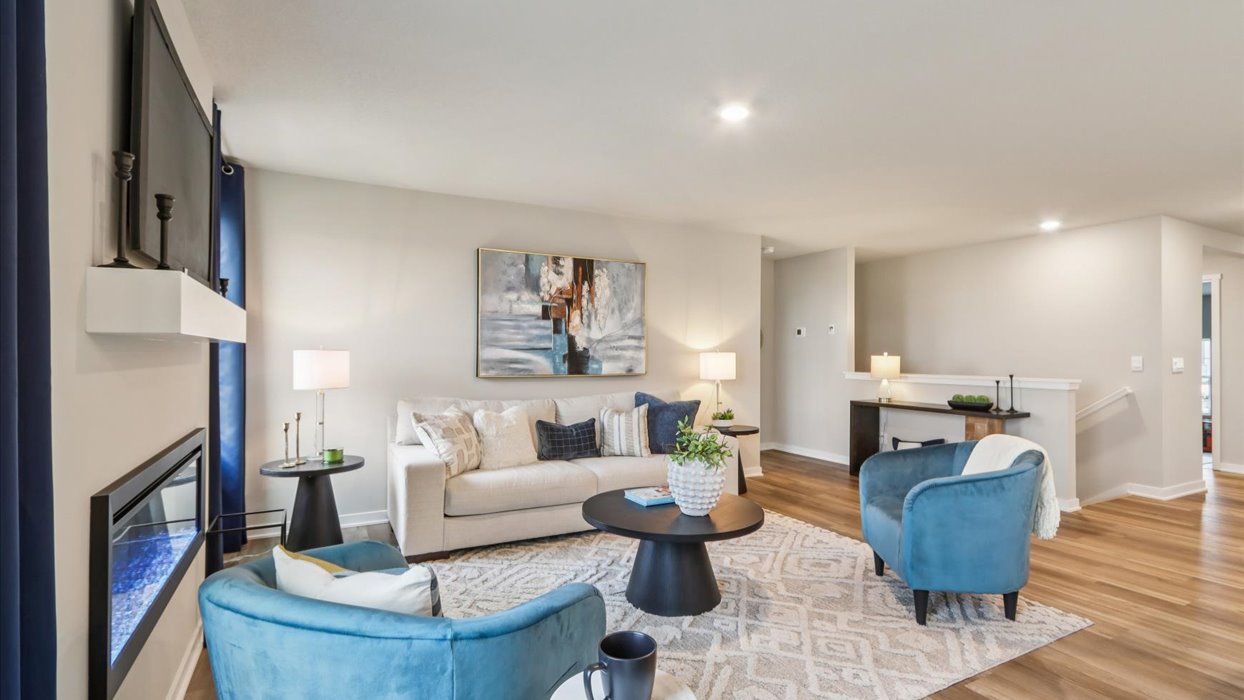 Open concept living room with electric fireplace