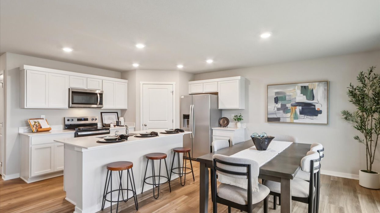 Open concept dining space with access to backyard