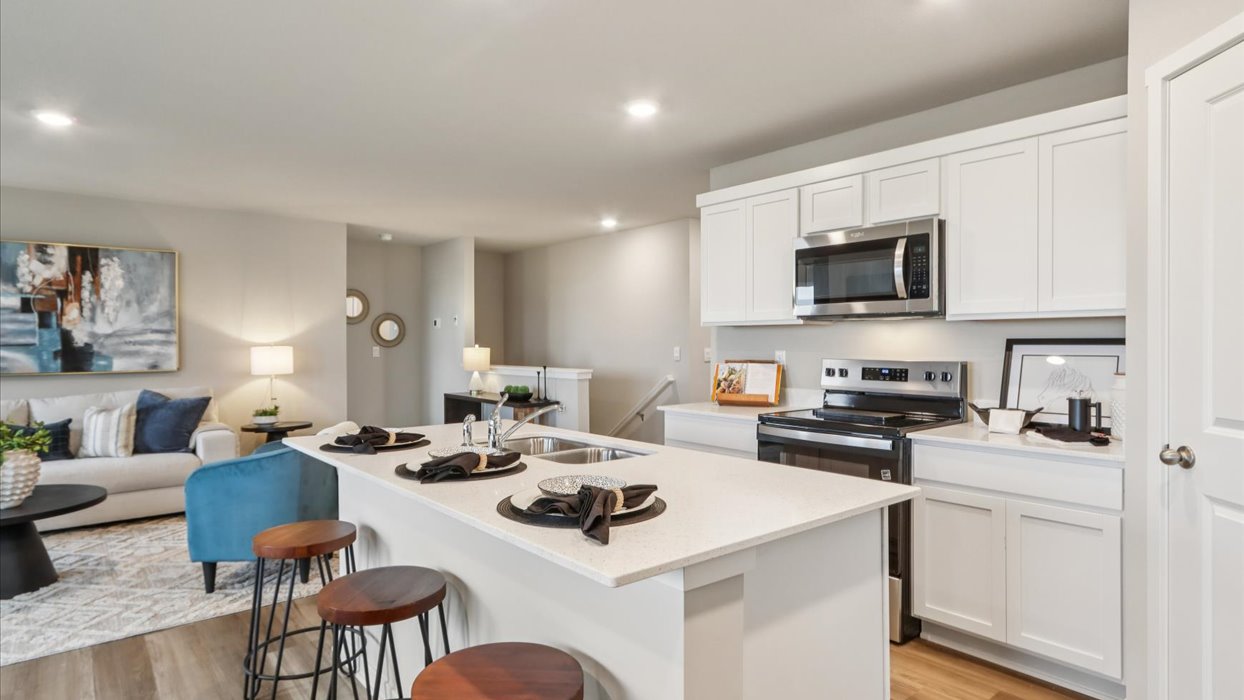 Kitchen with white cabinetry and quartz countertop