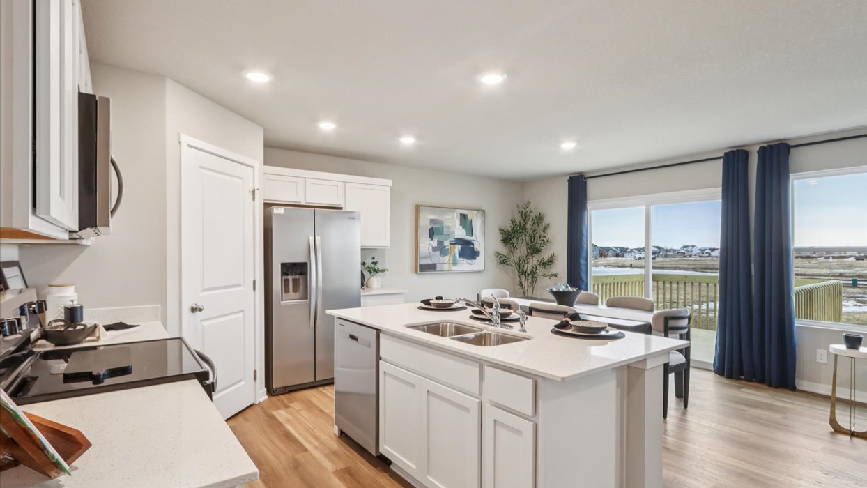 Kitchen with white cabinetry and quartz countertop