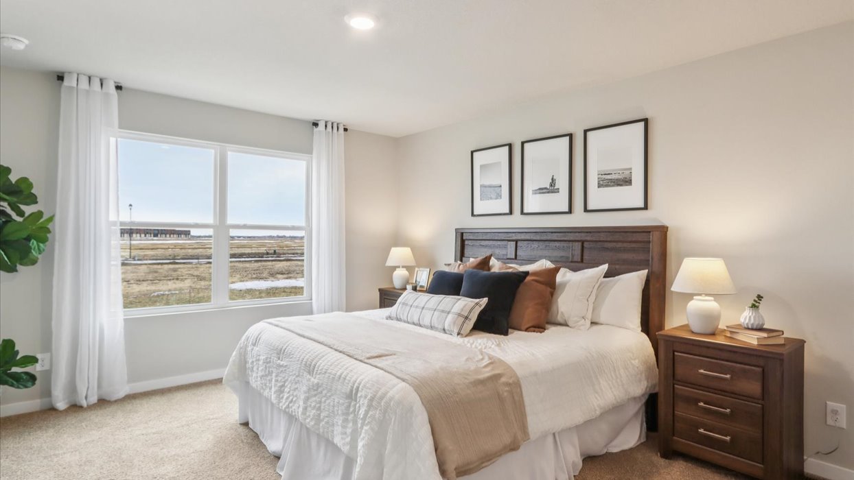 Primary bedroom with natural lighting and spacious layout