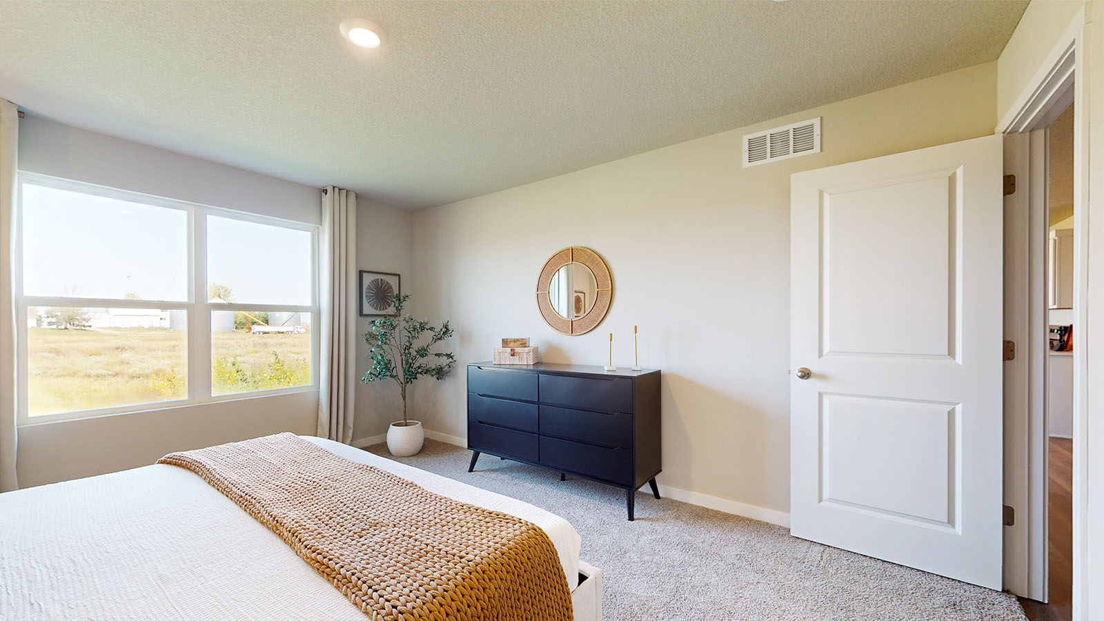 Primary bedroom designed with privacy and comfort in mind, flowing into spa-inspired ensuite and walk-in closet