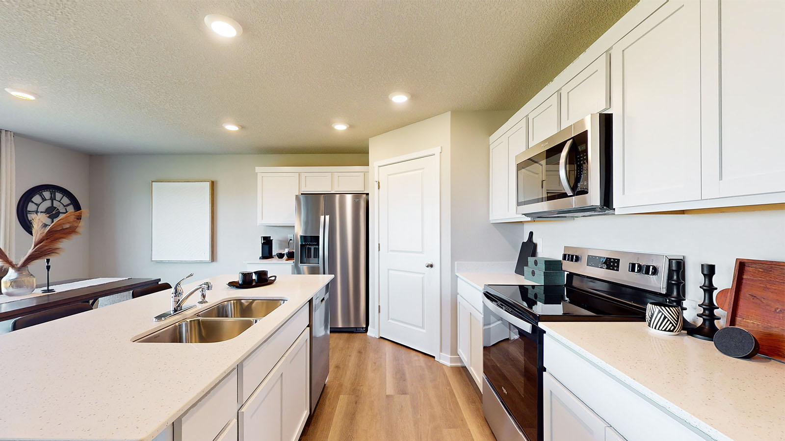 Island kitchen design offers new appliance suite included, storage, pantry, sink, and prep zones