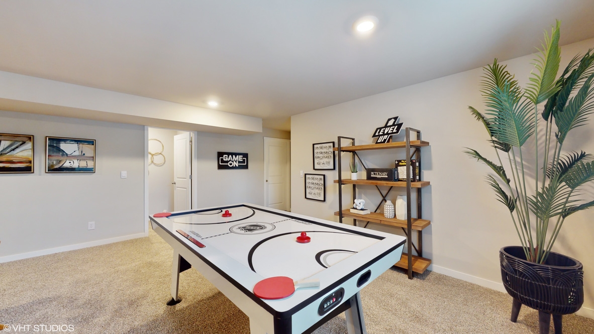 Finished basement living area with comfortable seating space and flexible room for entertaining or relaxing.