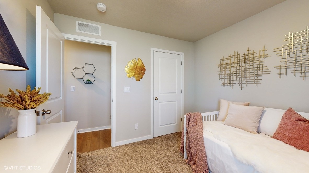 Comfortable secondary bedroom with natural light, modern finishes, and versatile living space.