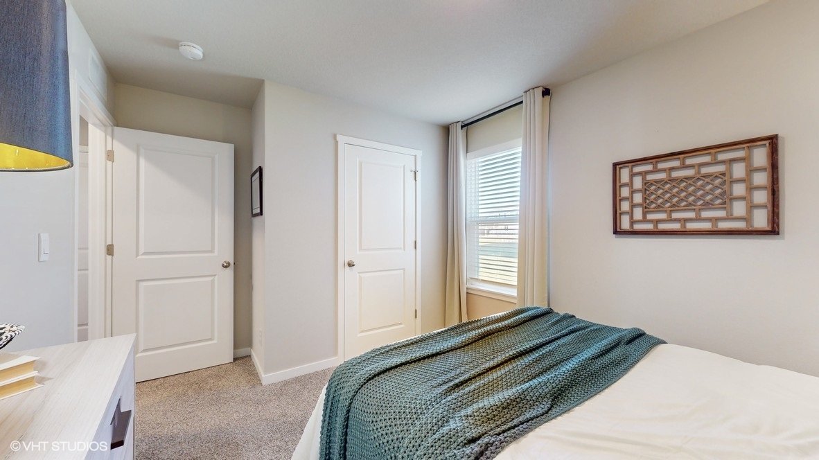 Comfortable secondary bedroom with natural light, modern finishes, and versatile living space.