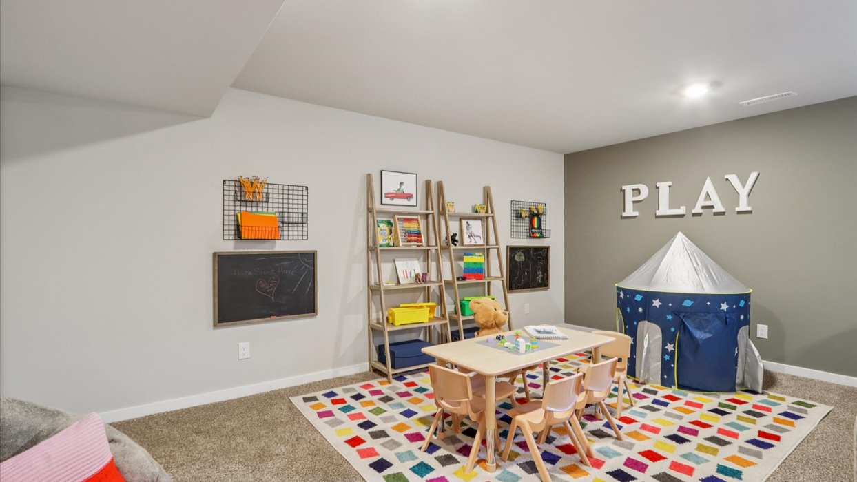 Finished basement living area with comfortable seating space and flexible room for entertaining or relaxing.