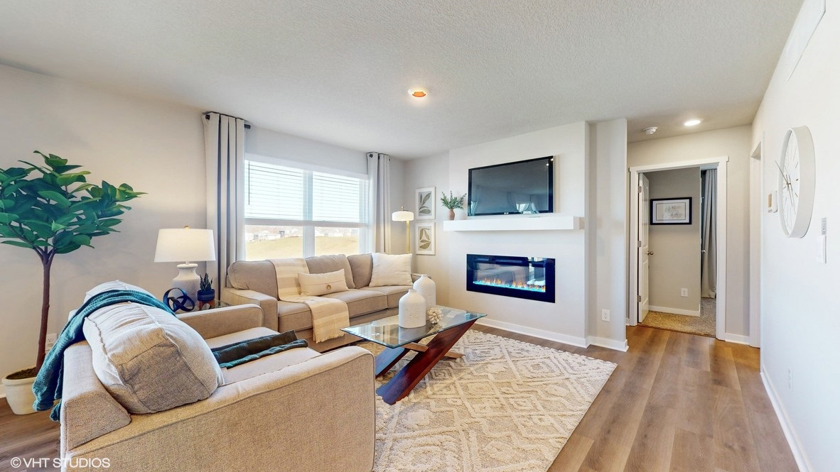Open concept living room with electric fireplace